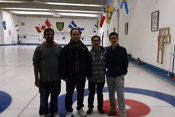 This is a photo of Dhamodaran Arunbabu, John Oh, Puzhen Li and Tongbing Sun at the departmental curling party